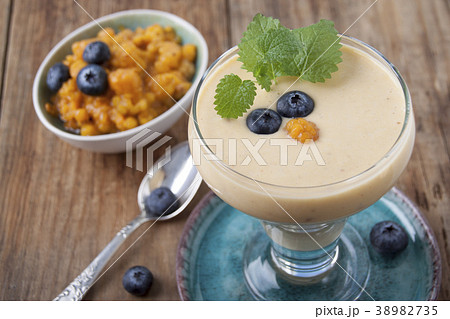 Smoothies with cloudberries and a blueberry 38982735