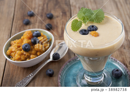 Smoothies with cloudberries  and a blueberry 38982738