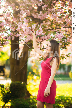 Beautiful girl posing to the photographer against 38983758