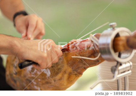 Jamon. Traditional Spanish ham on black close up Jamon. Traditional Spanish ham on black close up 38983902