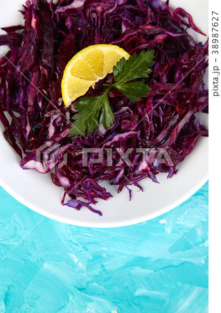 Shredded red cabbage in bowl. Shredded red cabbage in bowl. 38987627