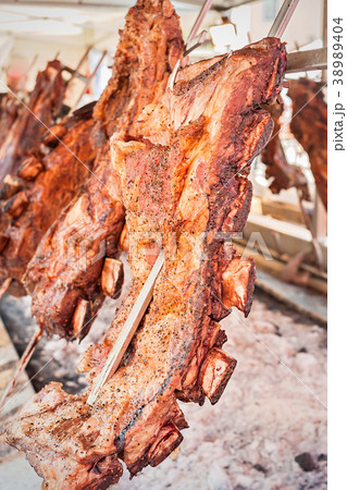 Roasted meat of beef cooking. Roasted meat of beef cooking. 38989404