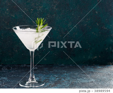 Glass of Martini coctail with fresh rosemary Glass of Martini coctail with fresh rosemary 38989594