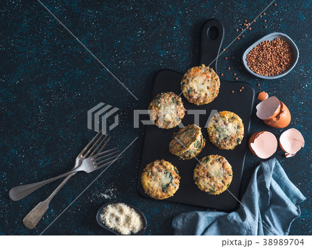 Buckwheat casserole with spinach, carrots parmesan 38989704