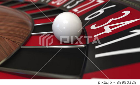 Casino roulette wheel ball hits 34 thirty-four red 38990328