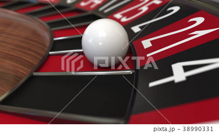 Casino roulette wheel ball hits 21 twenty-one red Casino roulette wheel ball hits 21 twenty-one red 38990331