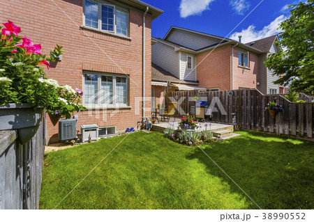 Backyard garden of custom built luxury house in 38990552