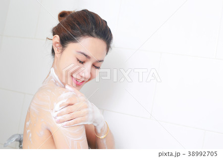 Woman taking a shower enjoying with foam bath. Woman taking a shower enjoying with foam bath. 38992705