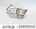 A shopping basket with a dollar bill 38993910