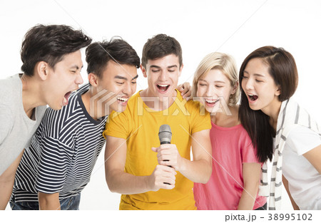 Group of happy friends singing song together. Group of happy friends singing song together. 38995102