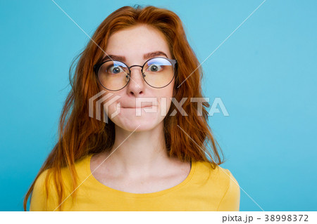 Headshot Portrait of happy ginger red hair girl 38998372