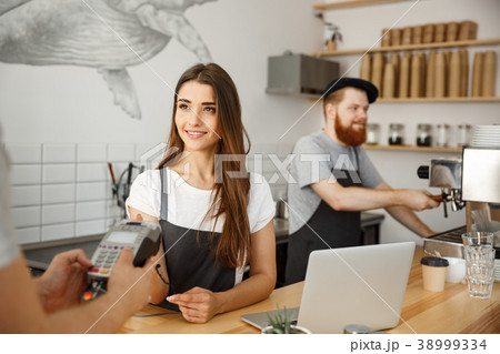 Coffee Business Concept - Beautiful female barista 38999334