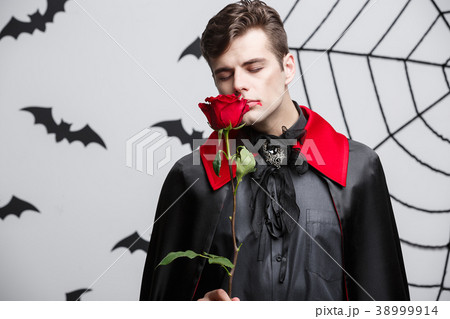 Vampire Halloween Concept - Portrait of handsome Vampire Halloween Concept - Portrait of handsome 38999914