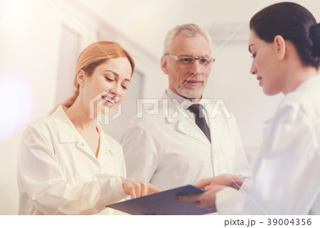 Attractive blonde female pointing at mistake in 39004356