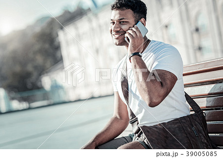 Happy joyful man making a call Happy joyful man making a call 39005085