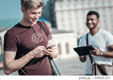 Happy young man using social media 39005107