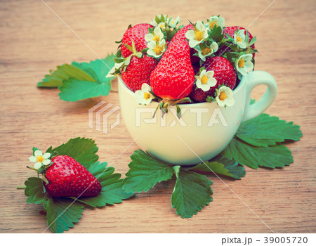 Strawberries in a white cap 39005720