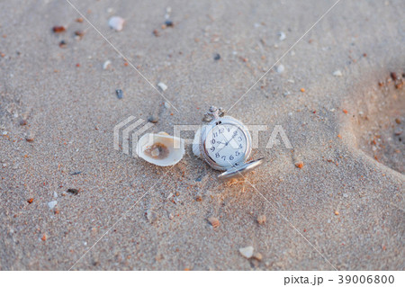 pocket watch on sea beach background. pocket watch on sea beach background. 39006800
