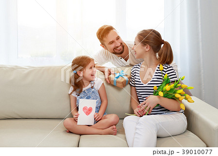 happy mother's day! father and child congratulate mother on holi 39010077