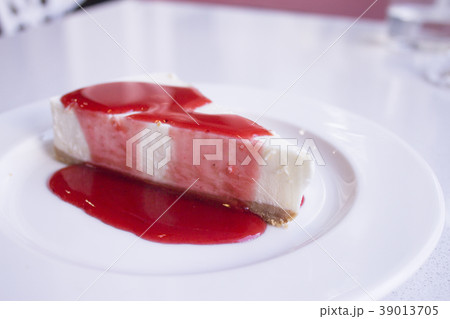 Cheesecake with strawberry syrup Cheesecake with strawberry syrup 39013705