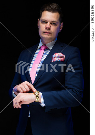 Portrait of confident handsome businessman showing 39016396