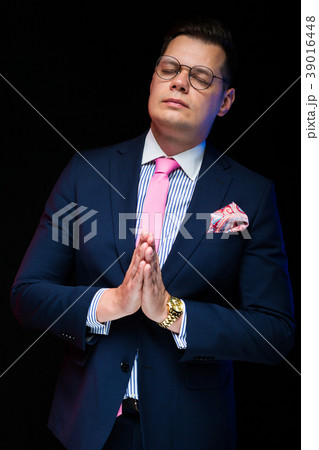 Portrait of confident handsome businessman showing Portrait of confident handsome businessman showing 39016448