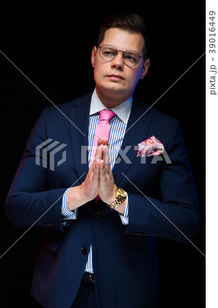 Portrait of confident handsome businessman showing Portrait of confident handsome businessman showing 39016449