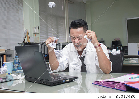 businessman working in office having a stress. 39017430