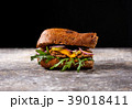 Sandwich with chicken, onion, greens and pickles 39018411