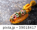 Big hot dog with greens, onion and jalapeno pepper 39018417