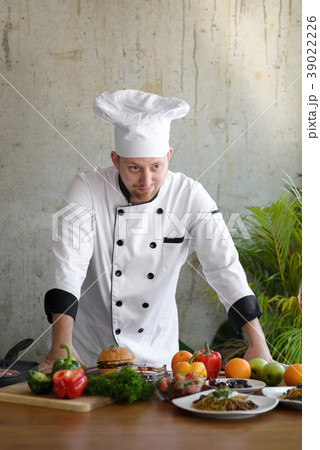 Professional chef looking at food and vegetable Professional chef looking at food and vegetable 39022226