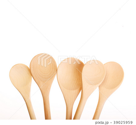 A lot of wooden spoons isolated on white. A lot of wooden spoons isolated on white. 39025959
