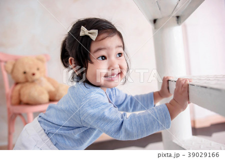 2 Years Old Child Smiling while Playing Hide& Seek 39029166