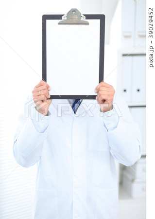 Unknown male doctor standing straight while 39029452