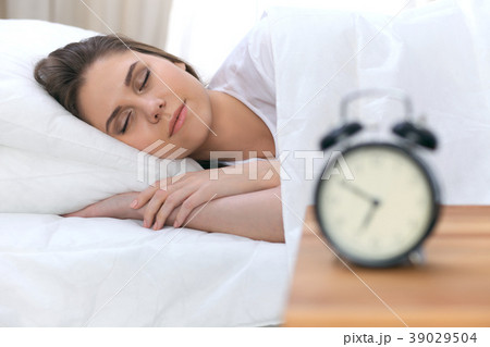 Beautiful young and happy woman sleeping while Beautiful young and happy woman sleeping while 39029504