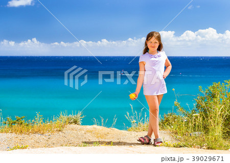 Girl with lemon posing against Cretan sea. Bali 39029671