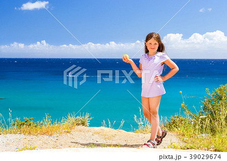 Girl with lemon posing against Cretan sea. Bali 39029674