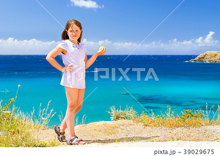 Girl with lemon posing against Cretan sea. Bali 39029675