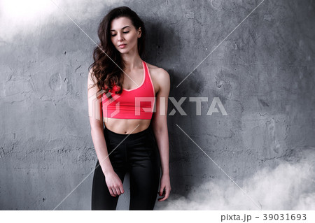 Woman portrait near the wall 39031693