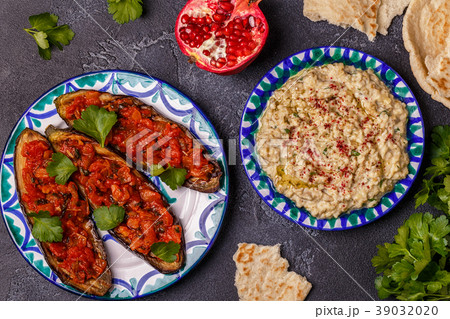 Classic baba ganush and baked eggplant with sauce. Classic baba ganush and baked eggplant with sauce. 39032020