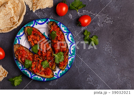 Baked eggplant with tomatoes, onion, garlic Baked eggplant with tomatoes, onion, garlic 39032021