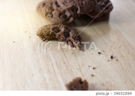 Chocolate cookies on wooden table. Chocolate cookies on wooden table. 39032894
