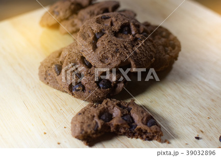 Chocolate cookies on wooden table.  39032896