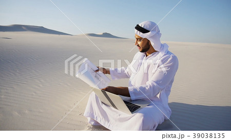 Muslim Arabian UAE Sheikh architect sitting with 39038135