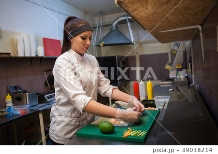 a girl prepares food sushi a girl prepares food sushi 39038214