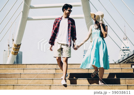 Couple Asian travelers enjoying vacations in city Couple Asian travelers enjoying vacations in city 39038611
