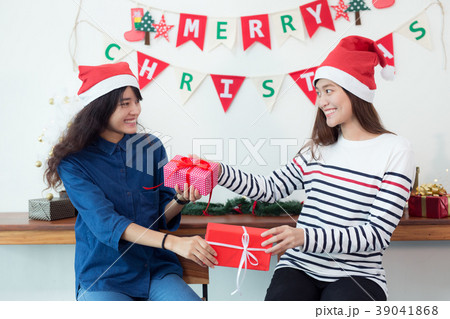 Beautiful young female is celebrating at home 39041868