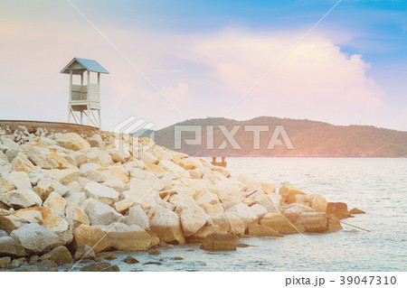 White stand watching lifeguard over sea coast White stand watching lifeguard over sea coast 39047310
