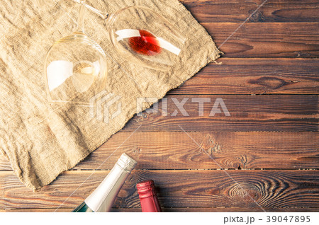 Picture of two wine bottles and wine glasses on 39047895