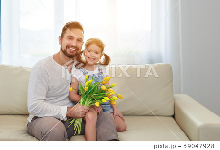 father and child daughter with a bouquet of flowers father and child daughter with a bouquet of flowers 39047928